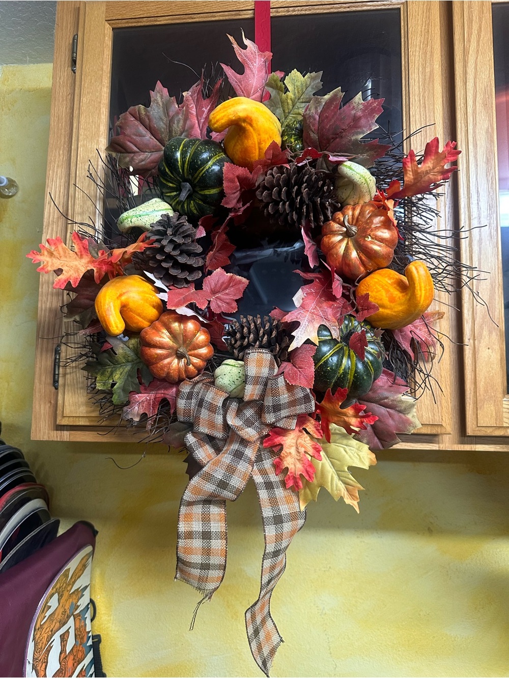 Fall Harvest Decorative Wreath with squash and gourds.